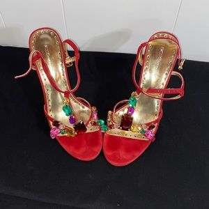 Size 7.5 heels red in color with gems